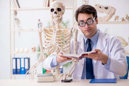 Crazy professor studying human skeleton