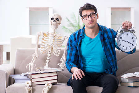Student studying with skeleton preparing for exams