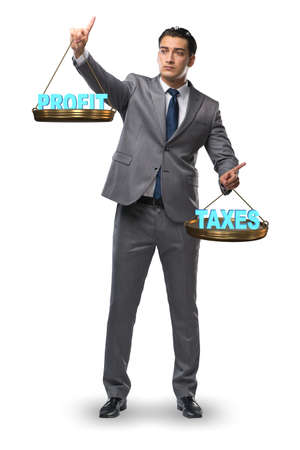 Businessman comparing profit and taxesの写真素材