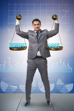 Businessman in cost benefit balance conceptの写真素材