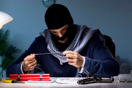 Terrorist bomber preparing dynamite bombの写真素材