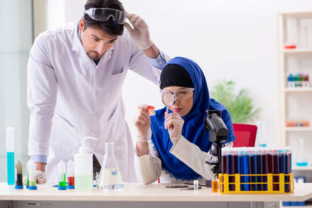 Two chemists working in the labの写真素材