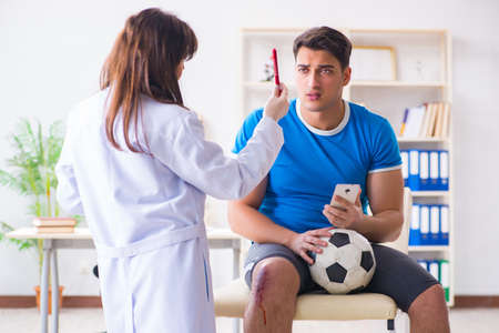 Football soccer player visiting doctor after injuryの写真素材