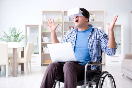 Freelance student studying with laptop and virtual reality glassの写真素材
