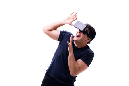 Man playing with virtual reality glasses on white background
