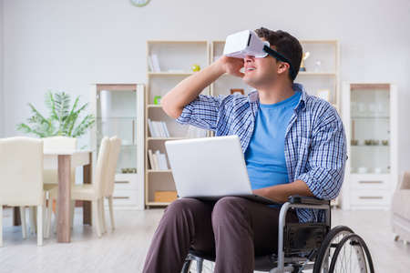 Freelance student studying with laptop and virtual reality glassの写真素材