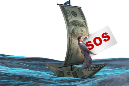 Businessman asking for help with SOS message on boatの写真素材