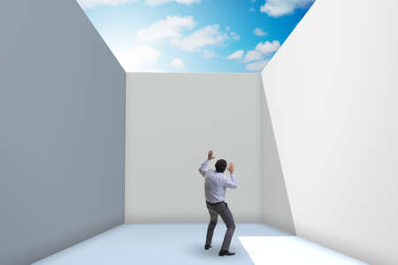 Businessman trying to escape from difficult situationの写真素材