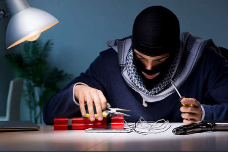 Terrorist bomber preparing dynamite bombの写真素材