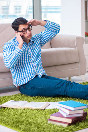 Young student preparing for exams at homeの写真素材