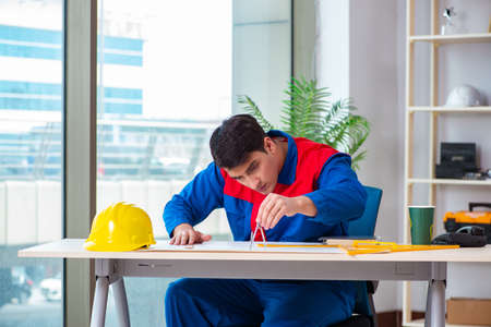Foreman looking at construction planの写真素材