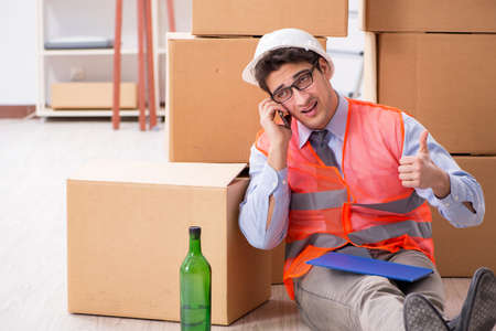 Delivery man drunk at workの写真素材