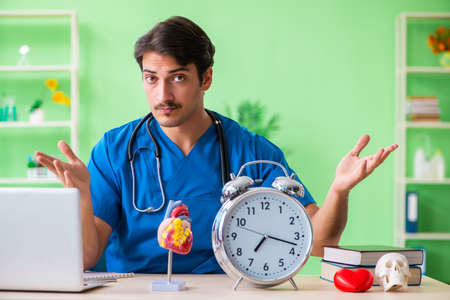 Doctor student explaining heart problemsの写真素材