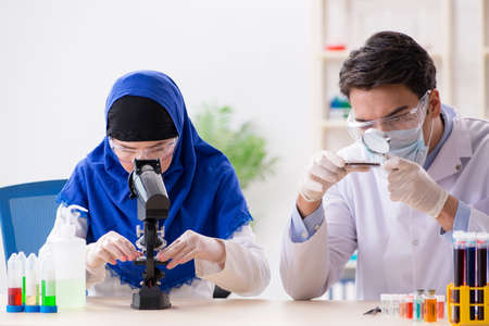 Two chemists working in the labの写真素材