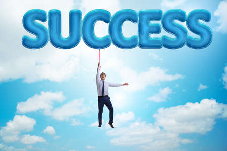 Businessman flying in success conceptの写真素材
