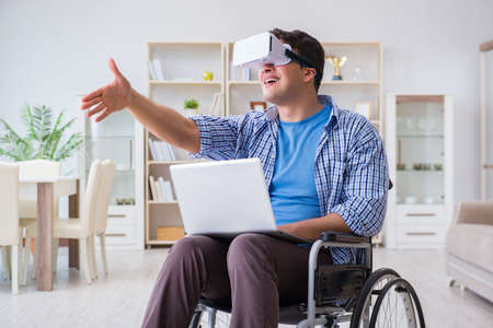 Freelance student studying with laptop and virtual reality glassの写真素材