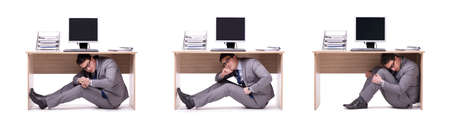 Businessman hiding in the oficeの写真素材