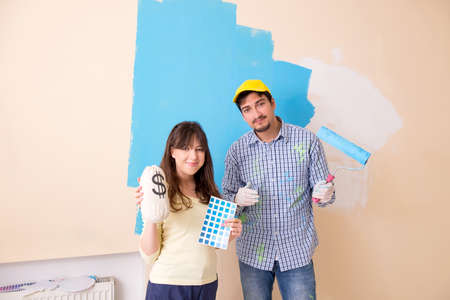 Husband and wife doing renovation at home
