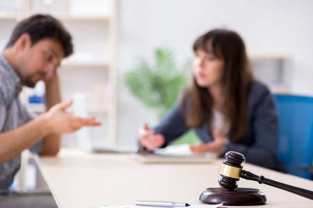 Female lawyer meeting with his male client in the officeの写真素材