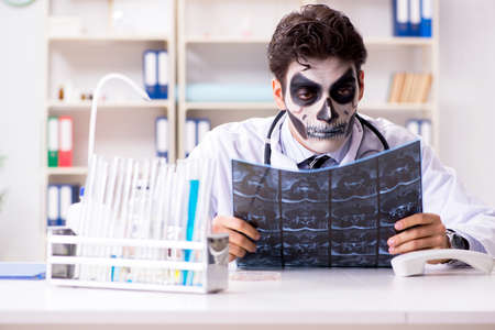 Scary monster doctor working in labの写真素材