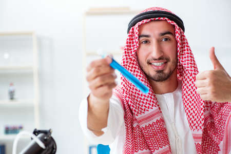 Arab chemist working in the lab officeの写真素材