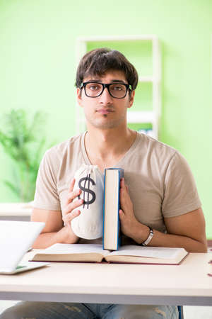 Young student in expensive tuition conceptの写真素材