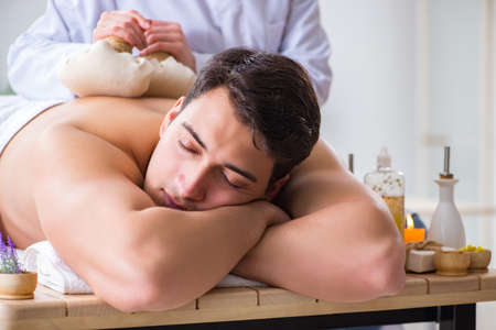 Man in spa enjoying his timeの写真素材