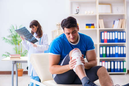 Sports player visiting doctor after injury