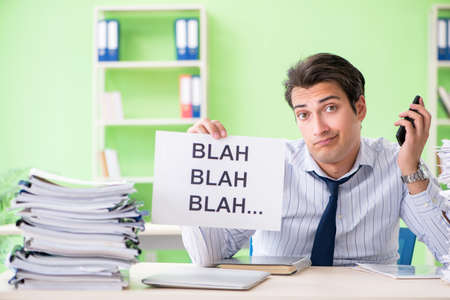 Businessman having problems with paperwork and workload