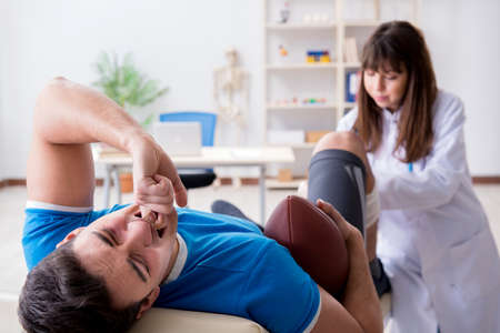 American football player with injury visiting doctorの写真素材