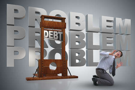 Businessman in heavy debt business conceptの写真素材