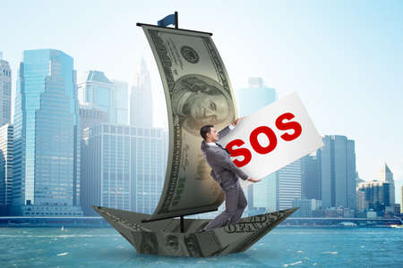 Businessman asking for help with SOS message on boatの写真素材