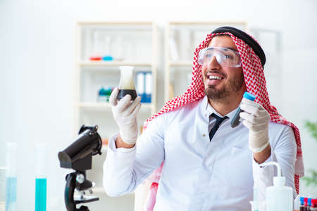 Arab chemist scientist testing quality of oil petrolの写真素材