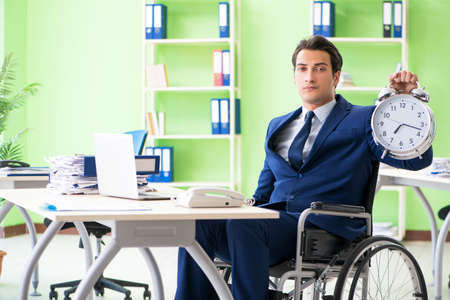 Disabled businessman working in the officeの写真素材
