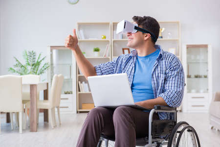 Freelance student studying with laptop and virtual reality glassの写真素材