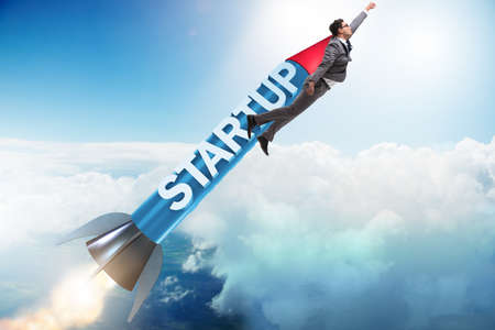 Businessman in start-up concept flying on rocket