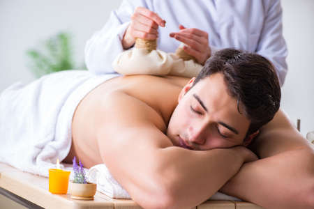 Man in spa enjoying his timeの写真素材