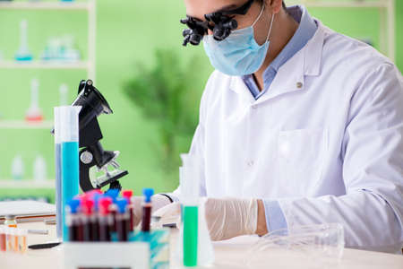 Man chemist working in the lab
