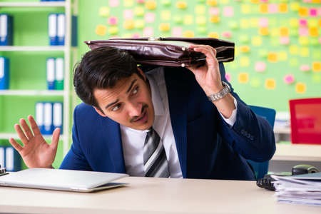 Businessman with many conflicting prioritiesの写真素材