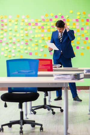 Businessman with many conflicting prioritiesの写真素材