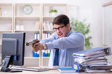Stressful businessman working in the officeの写真素材
