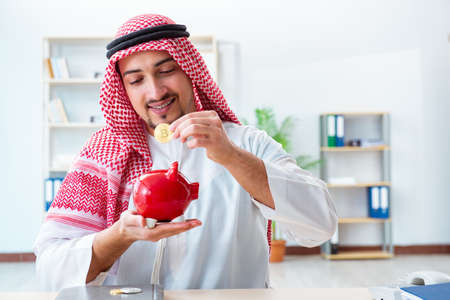 Arab man with bitcoin in cryptocurrency mining conceptの写真素材