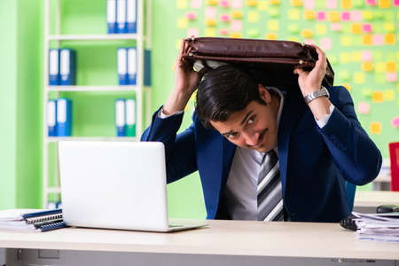 Businessman with many conflicting prioritiesの写真素材