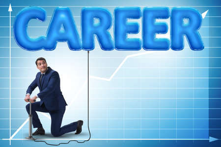 Businessman pumping career in business conceptの写真素材