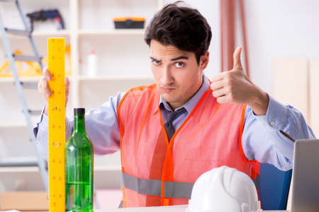 Drunk engineer working in the workshop