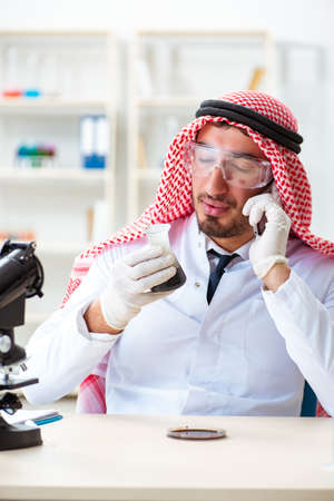 Arab chemist working in the lab officeの写真素材