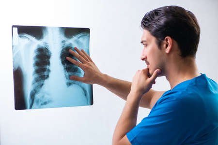 Young handsome doctor radiologyst working in hospital