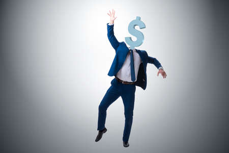 Businessman with dollar sign instead of headの写真素材