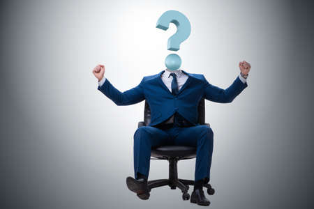 Businessman with question mark instead of headの写真素材
