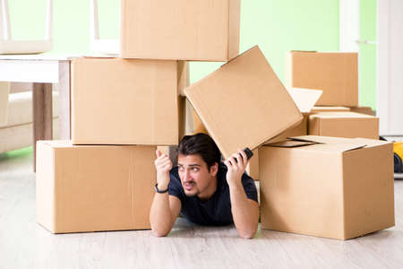 Man moving house with boxesの写真素材